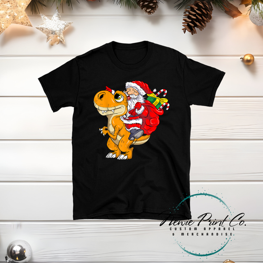 Santa riding Dino - Christmas T-shirt